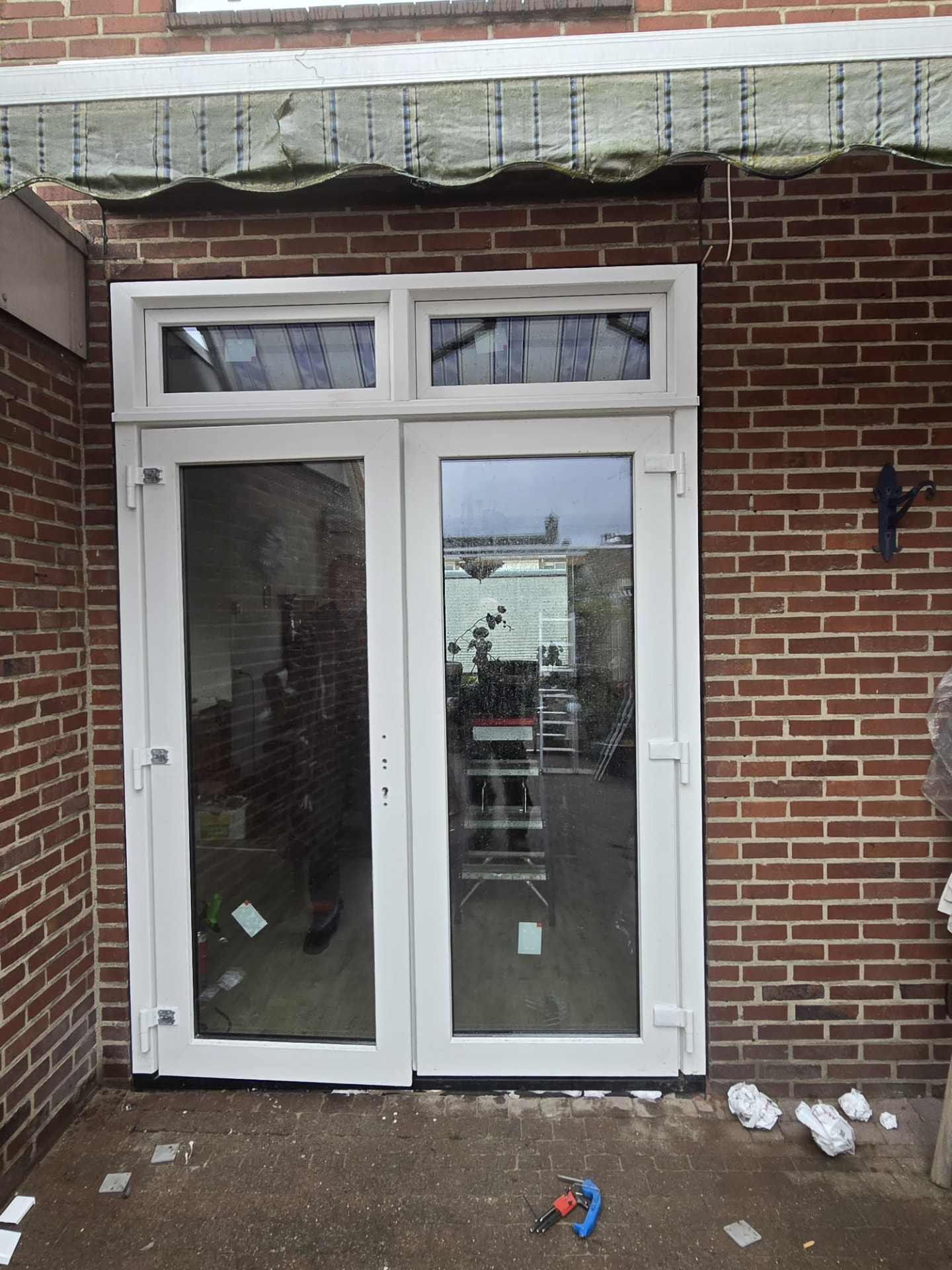 uPVC French garden doors with transom light installed in Veldhoven