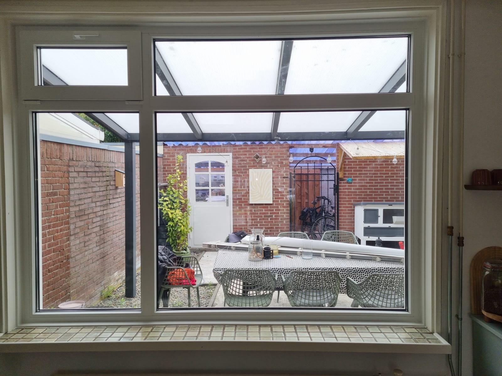 uPVC window frame with top vents installed in a living room in Geldrop