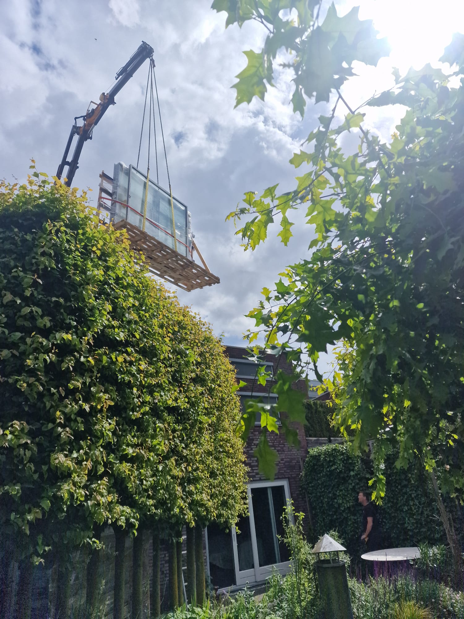 Looking up: glass lifted over the house